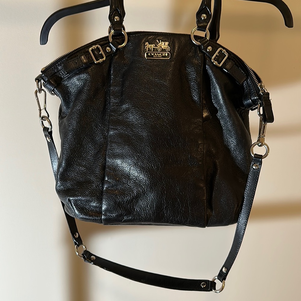Black leather Coach purse. Strap and Handles. Zipper close. Satin lined.